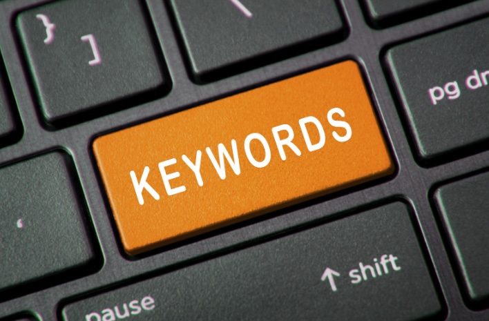 "Keyword" written on an orange laptop enter key