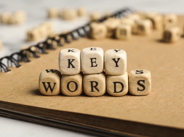 Wooden cubes spelling out 'keywords'